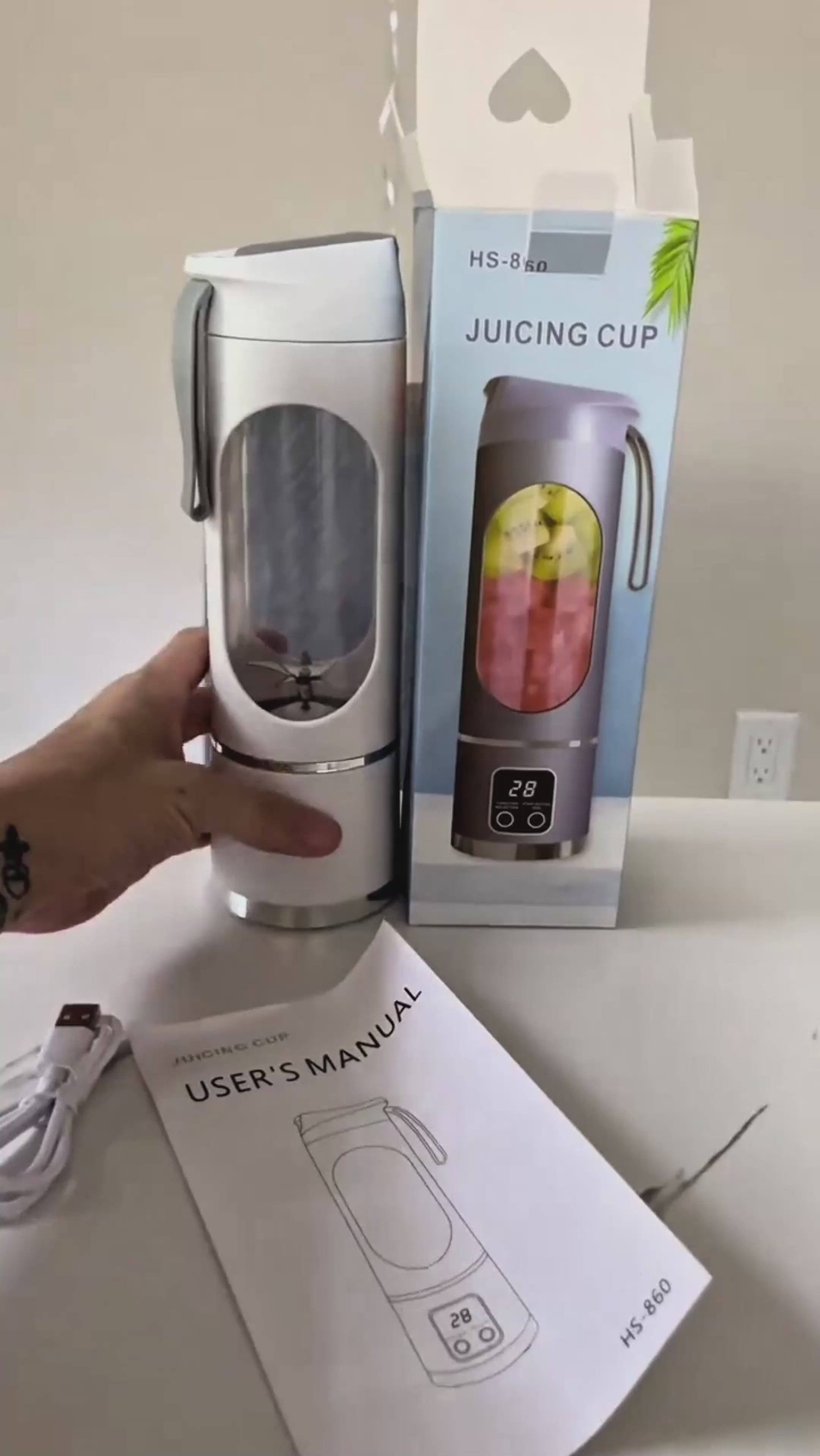 Load video: Olyvro portable blendtester blending a red berry smoothie