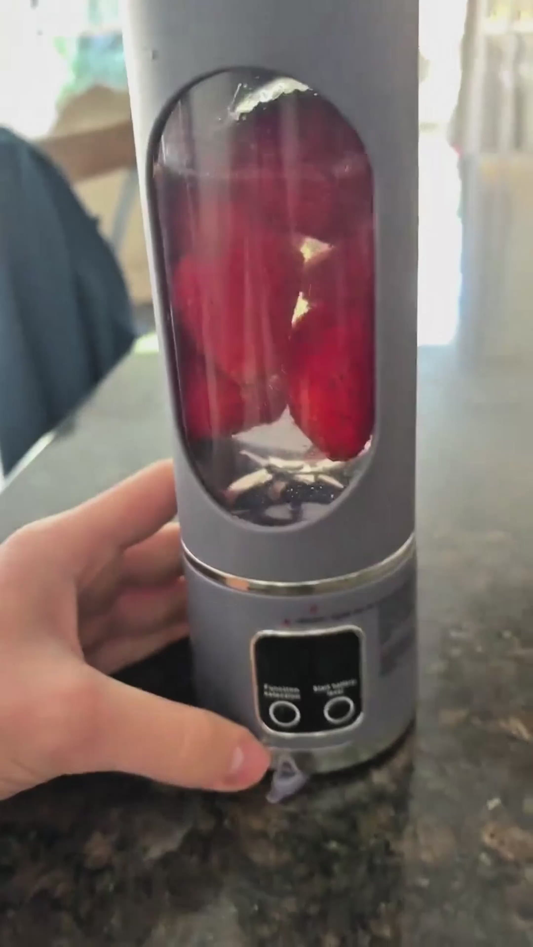 Load video: Olyvro portable blendtester blending a red berry smoothie